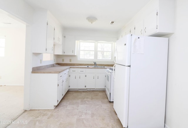 kitchen featuring visible vents, a sink, white cabinetry, white appliances, and light countertops