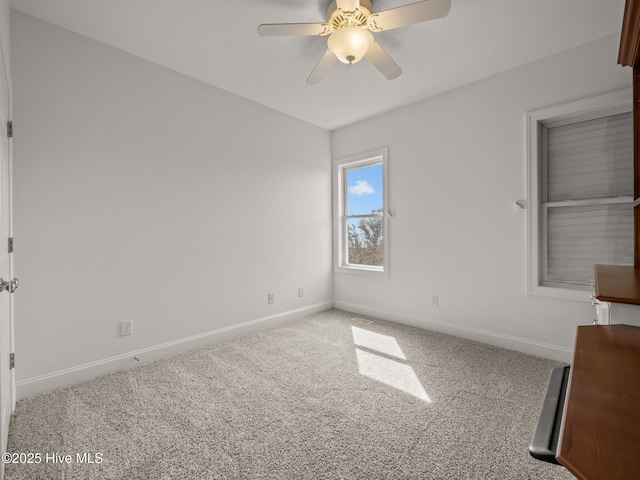 unfurnished bedroom with baseboards, carpet floors, and ceiling fan