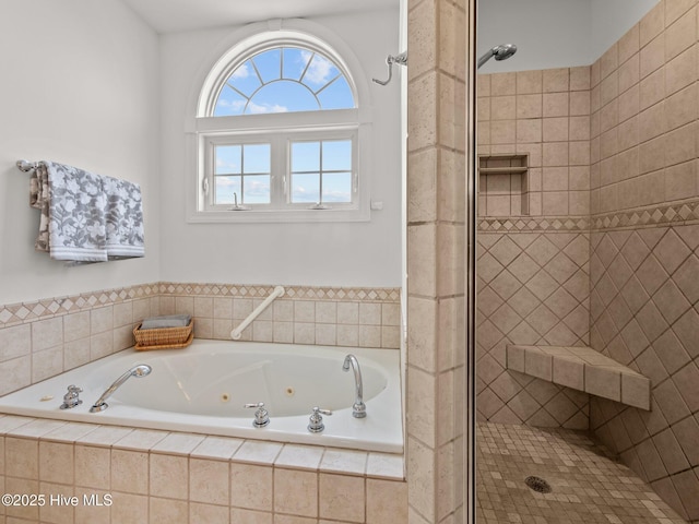 bathroom featuring a jetted tub and a stall shower