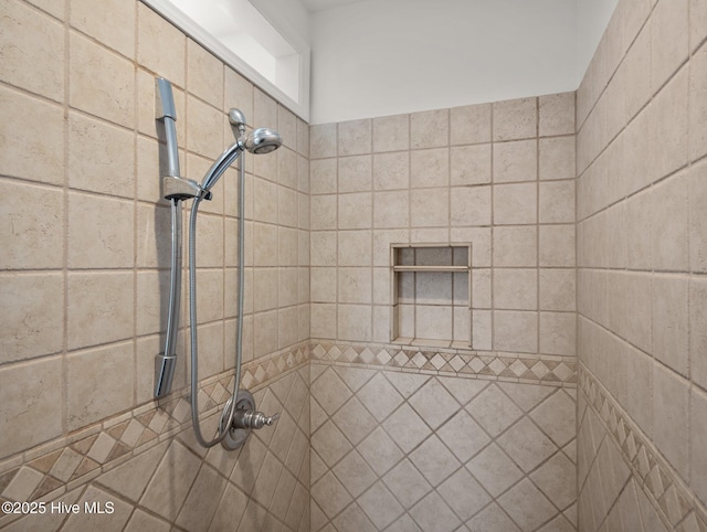 full bathroom with tiled shower