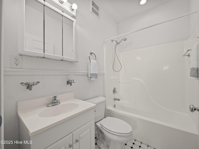 full bath with visible vents, toilet, vanity, and shower / tub combination