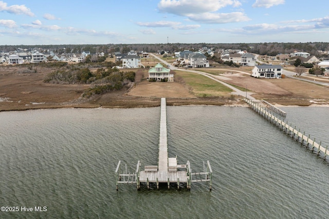 bird's eye view with a residential view and a water view