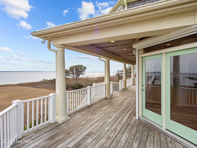 wooden terrace with a water view