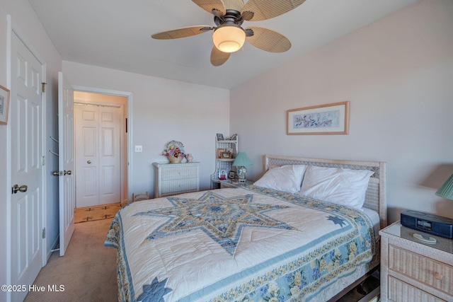 carpeted bedroom with ceiling fan