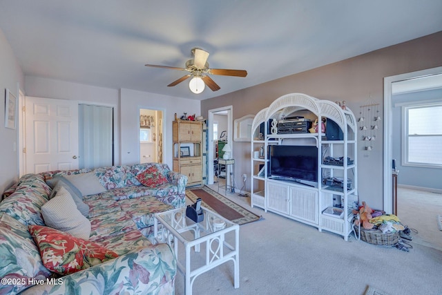 living room with ceiling fan and carpet floors