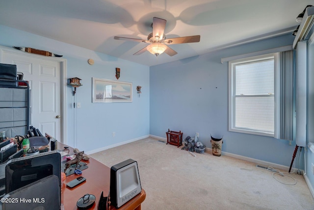 interior space featuring visible vents, baseboards, and ceiling fan