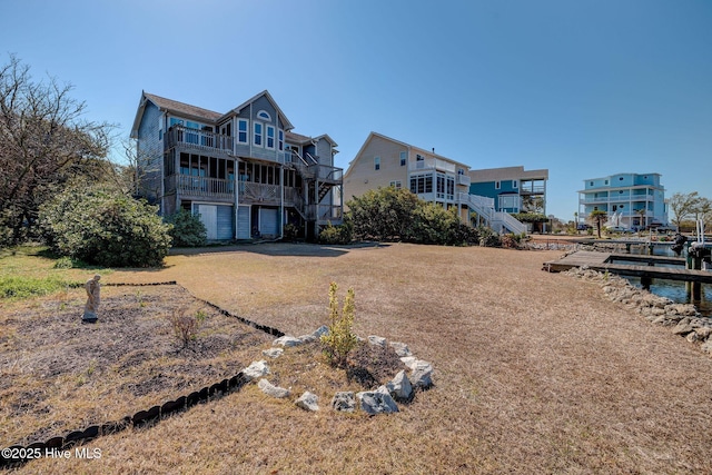 rear view of property with stairway