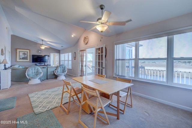 dining room with visible vents, carpet floors, a ceiling fan, and vaulted ceiling