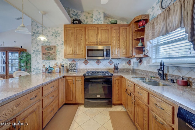 kitchen featuring black gas range oven, lofted ceiling, light tile patterned flooring, a sink, and stainless steel microwave