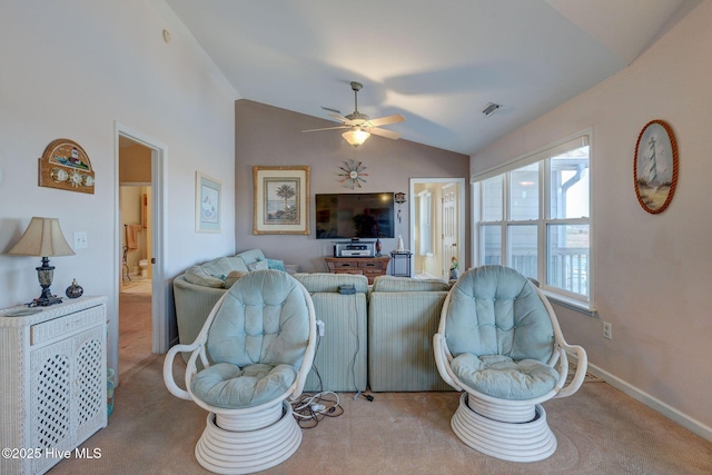 living area featuring visible vents, a ceiling fan, carpet, baseboards, and vaulted ceiling