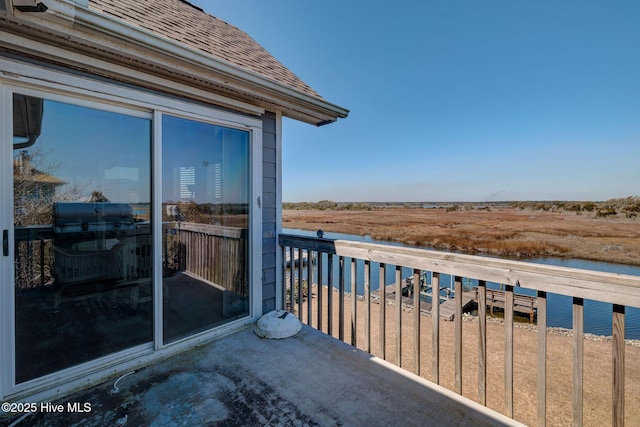 balcony featuring a water view