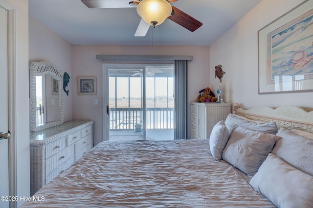 bedroom featuring access to exterior and a ceiling fan