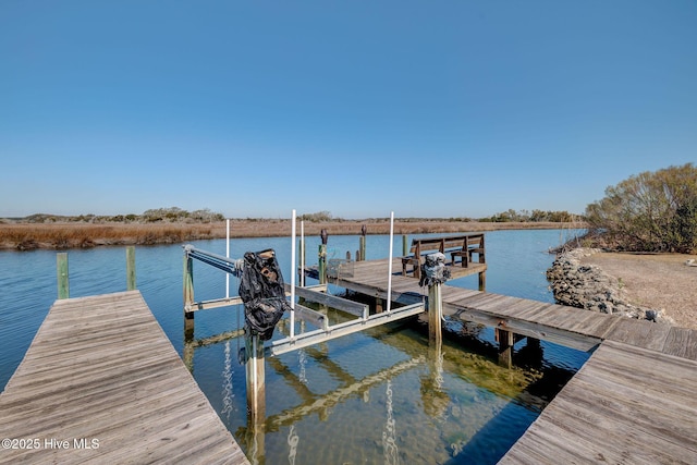 view of dock with a water view and boat lift