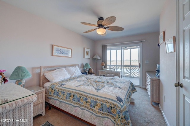 bedroom with baseboards, light carpet, a ceiling fan, and access to outside