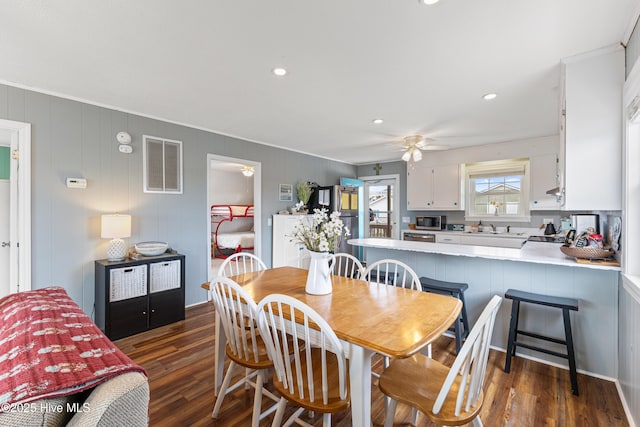 dining space with recessed lighting, a ceiling fan, visible vents, and dark wood-style flooring