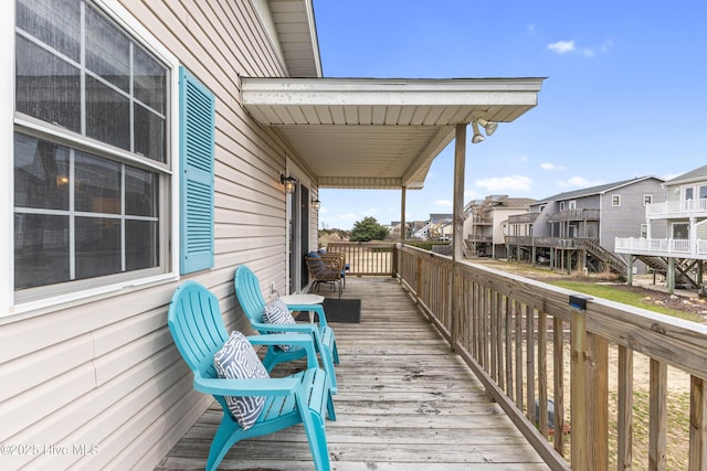 wooden terrace featuring a residential view