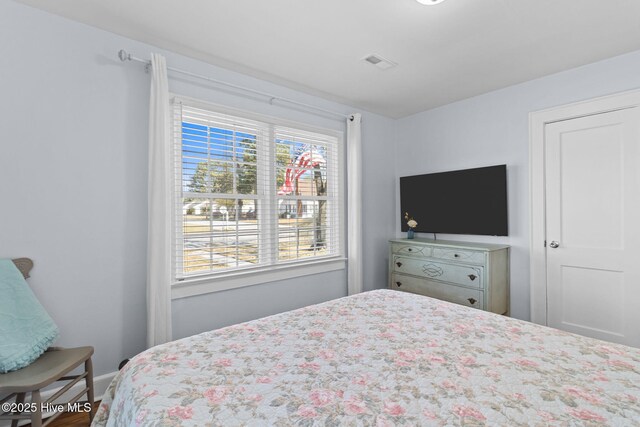 bedroom featuring visible vents