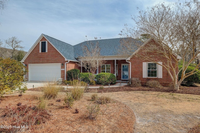 view of front facade featuring a garage, brick siding, concrete driveway, and a shingled roof