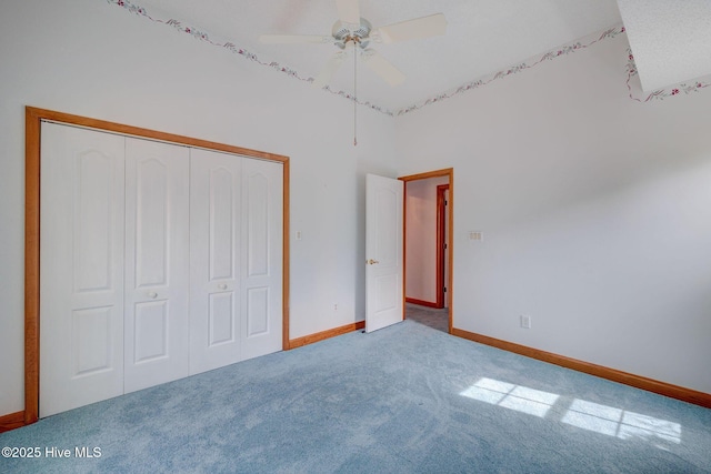 unfurnished bedroom featuring a closet, a ceiling fan, baseboards, and carpet floors