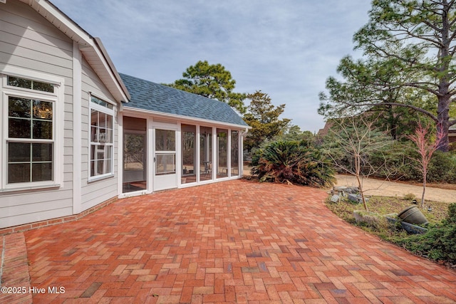 view of patio / terrace with a sunroom