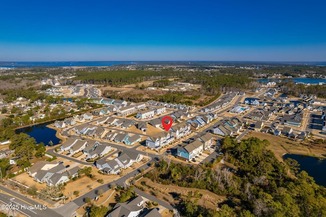 bird's eye view with a water view and a residential view