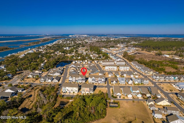 bird's eye view featuring a residential view and a water view