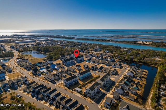 birds eye view of property featuring a water view and a residential view