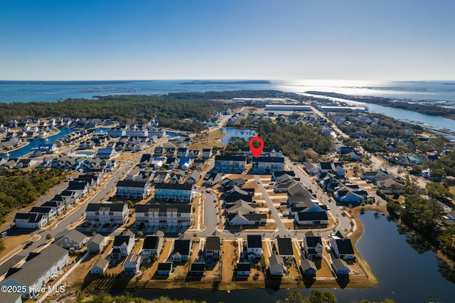 aerial view featuring a water view and a residential view