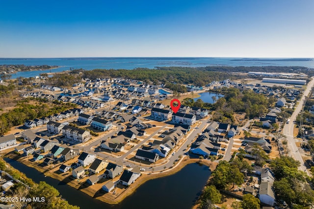 aerial view featuring a residential view and a water view