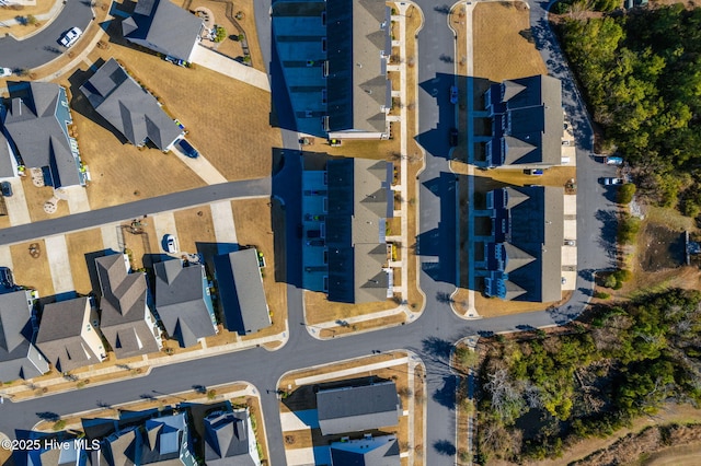 birds eye view of property with a residential view