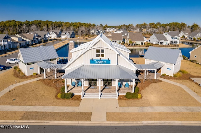 bird's eye view featuring a residential view and a water view