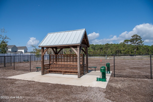 view of home's community with fence