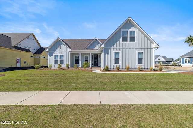 modern farmhouse with board and batten siding and a front yard