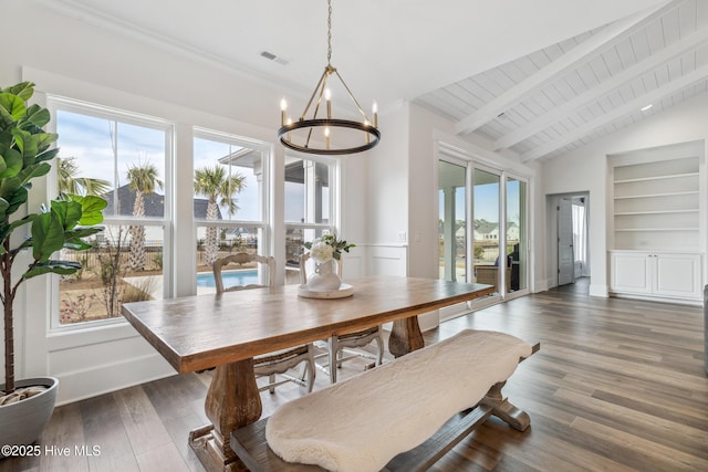 dining room featuring visible vents, a wealth of natural light, and a notable chandelier
