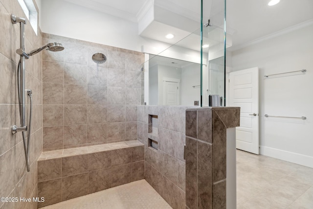 bathroom with ornamental molding, baseboards, tiled shower, and recessed lighting