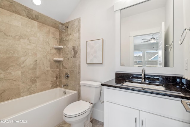 full bathroom featuring shower / washtub combination, vanity, a ceiling fan, vaulted ceiling, and toilet