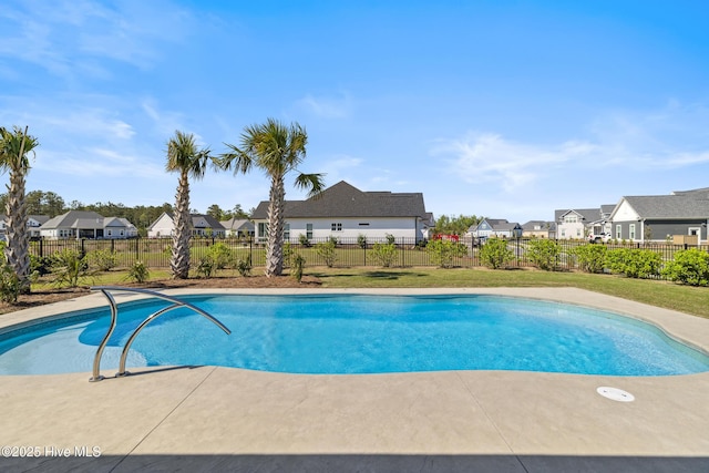 view of pool featuring fence, a fenced in pool, and a residential view