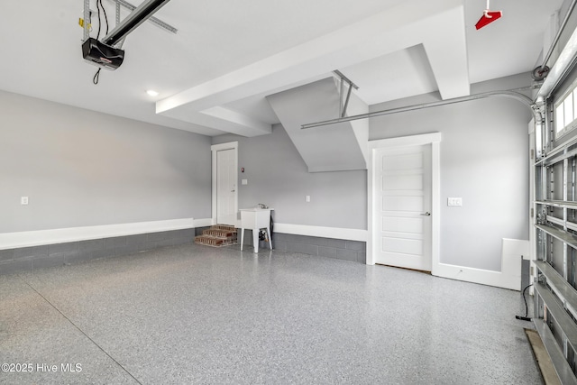 garage featuring a garage door opener
