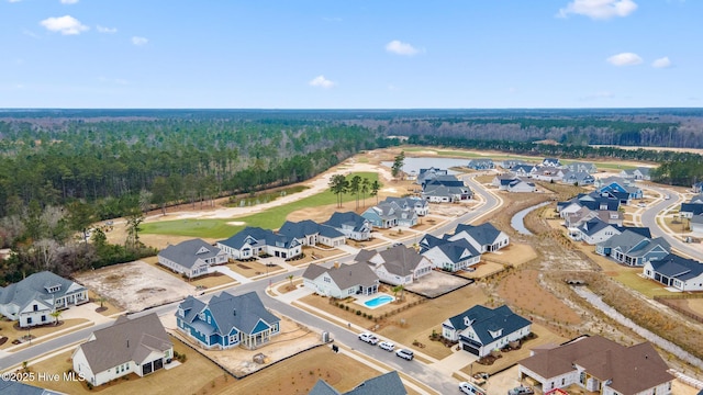 aerial view with a water view, a residential view, and a view of trees