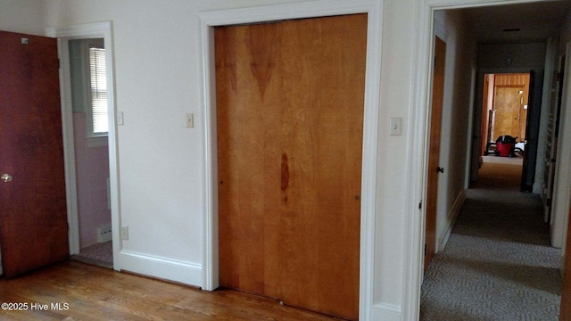 corridor featuring light wood-style flooring