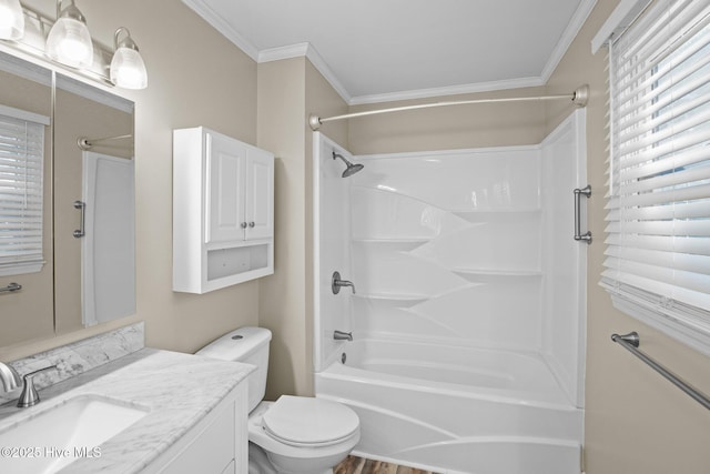 bathroom with toilet, vanity, bathtub / shower combination, and ornamental molding