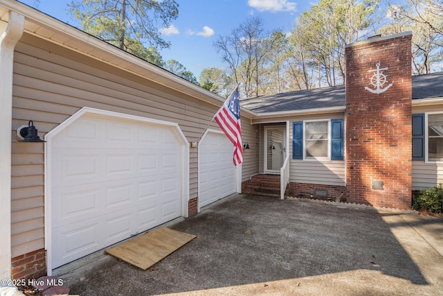 exterior space with crawl space, a garage, and a chimney