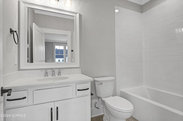 full bathroom featuring tub / shower combination, toilet, and vanity