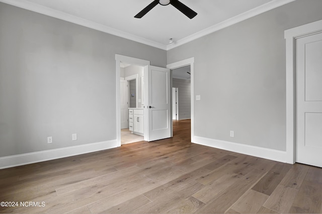 unfurnished bedroom with baseboards, light wood finished floors, ensuite bath, ceiling fan, and ornamental molding