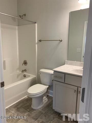 bathroom featuring toilet, vanity, and washtub / shower combination