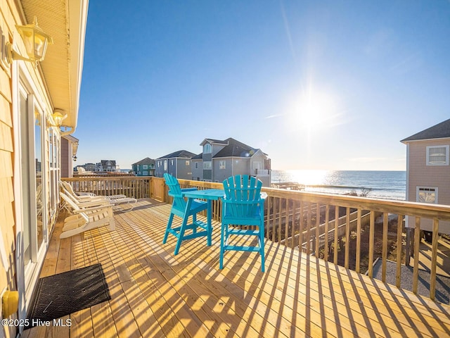 wooden deck with a water view