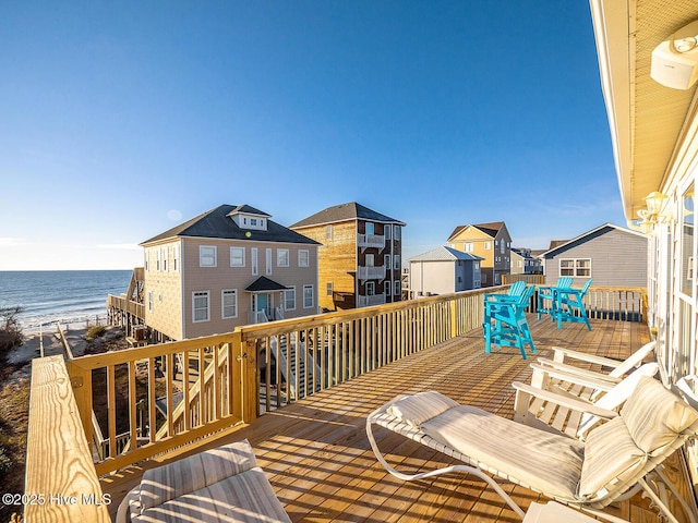 wooden deck featuring a water view