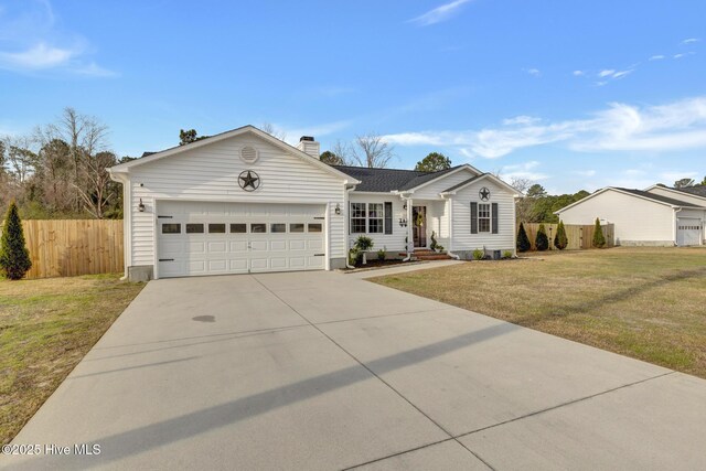 ranch-style home with a front lawn, fence, concrete driveway, a garage, and a chimney