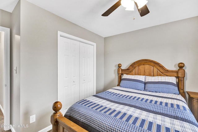 bedroom featuring a closet, baseboards, and ceiling fan