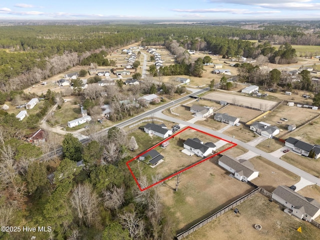 aerial view featuring a wooded view